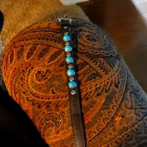 Leather and turquoise buckle bracelet.